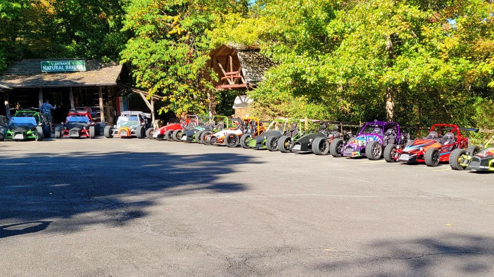 Line of DF Goblins parked under trees at GoblinFest 2022