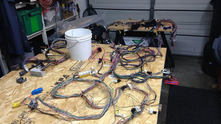Carl's DF Goblin wiring harness being reworked on a makeshift table in the garage.