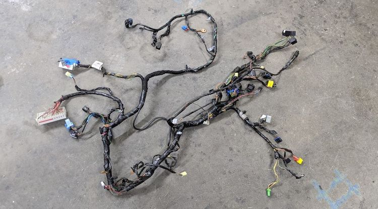 Dash wiring harness removed from a Chevrolet Cobalt dashboard, laid out flat with multiple branch connectors visible.