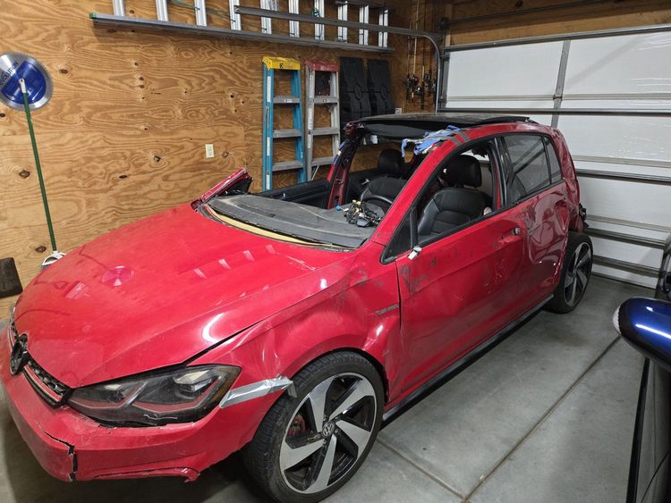 Val's totaled 2019 GTI in their home garage,